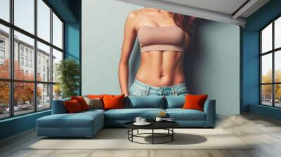 Cropped of fit woman with flat belly in casual cloths Wall mural