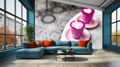 Two Beetroot super latte on marble background and ornament art floor. Trendy healthy pink matcha drink Wall mural