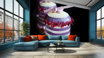 White and purple striped desserts with flower petals and meringues on golden coasters Wall mural