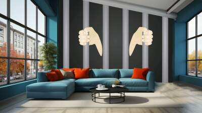 Hands hold prison bars. vector illustration Wall mural