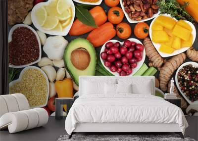 Health food for fitness concept with fruit, vegetables, pulses, herbs, spices, nuts, grains and pulses. High in anthocyanins, antioxidants, smart carbohydrates, omega 3,  minerals and vitamins. Wall mural