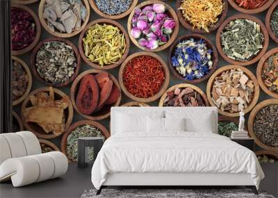 Herbal medicine used in alternative remedies with a variety of dried herbs and flowers in wooden bowls. Top view. Wall mural