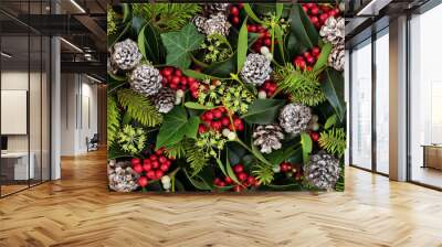 Natural winter and Christmas background with holly, ivy, mistletoe and pine cones. Traditional Christmas greeting card for the festive season. Wall mural