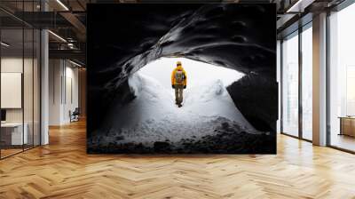  traveler finds himself detained in an impressive landscape of ice inside the Vatnajokull National Park, in Iceland. The dazzling ice formations and intricate patterns reveal the magnificent beauty o Wall mural