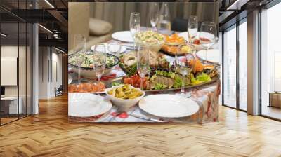 A beautiful served table for a holiday with a dish of baked fish. Wall mural