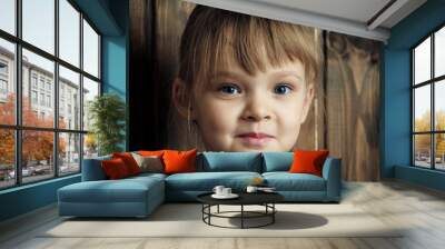 beautiful little girl is looking at you Wall mural