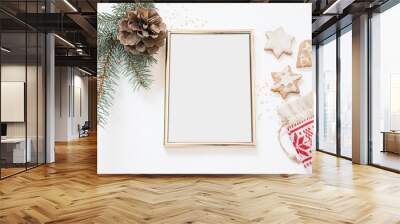 Christmas styled poster frame mockup | winter themed mockup golden frame photo | stationary winter items pine tree branch pine cone and home backed cookies | nordic design  Wall mural