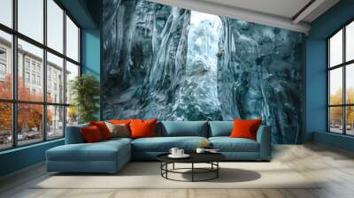 Exploring woman observes nature inside an ice cave Wall mural