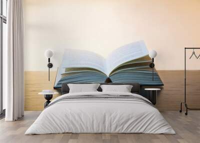 Open book on white background Wall mural