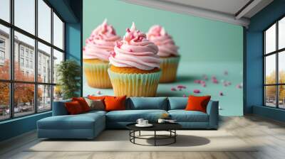 cupcakes isolated on light yellow background Wall mural