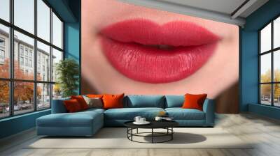 permanent makeup on the lips of a young woman of a delicate peach shade close-up, a girl after a cosmetic procedure with smooth and clean healthy skin.	
 Wall mural