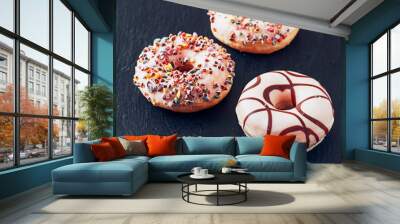 Sweet donuts on the slate serving plate Wall mural