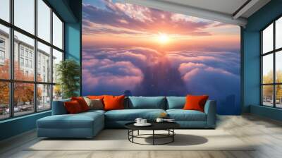 A breathtaking sunrise shines over a distant cityscape nestled in a sea of clouds Wall mural