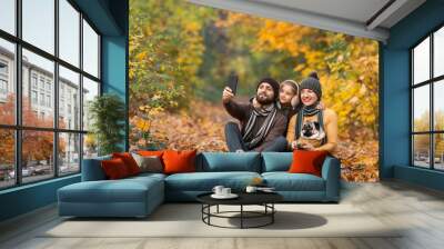 holidays, vacation, travel and tourism concept - group of friends or couples having fun in autumn park and taking selfie Wall mural