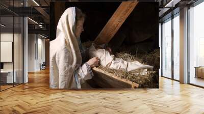 Woman near the baby in the manger Wall mural