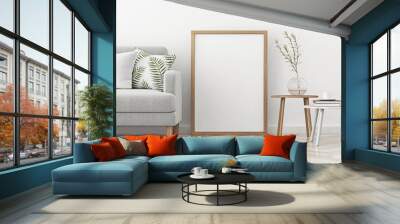 interior poster mock up with vertical frame standing on the floor in scandinavian style livingroom.  Wall mural