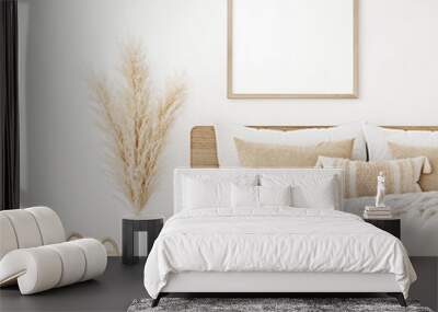 Square frame mockup in boho bedroom interior with wooden bed, beige blanket, pillow with tassels, dried pampas grass and basket on white wall background. 3d rendering, 3d illustration Wall mural