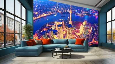 Aerial view of the Shanghai city skyline overlooking Pudong Financial District and Huangpu River at night from the Shanghai Tower. China. Wall mural