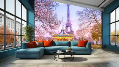 The Eiffel Tower and vintage carousel on a winter evening in Paris, France. Wall mural