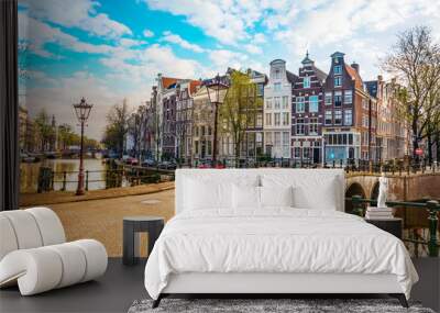 Traditional dutch old houses and bridges on canals in Amsterdam,  Netherlands Wall mural