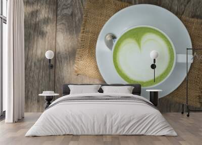 Green tea latte on wood background Wall mural