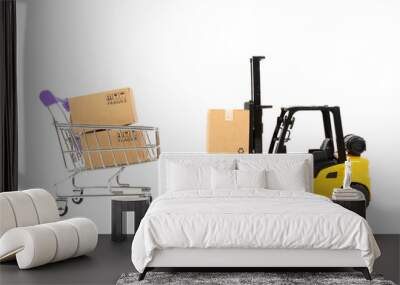 Mini forklift truck loading paper boxes into the trolley on white background. online shopping concept Wall mural