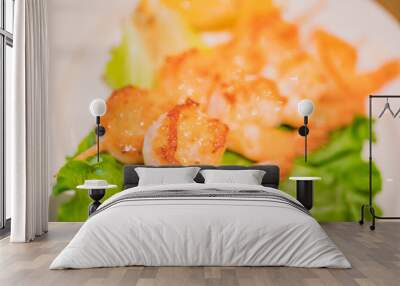 Typical Japanese dish of shrimps just seared in soy sauce, over a bed of lettuce. Wall mural