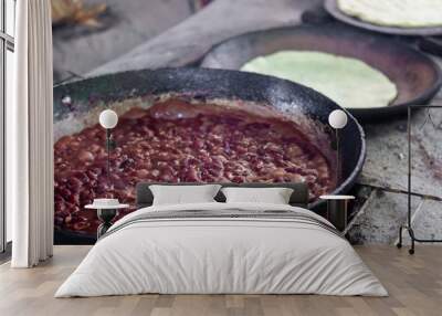 refried beans cooked in a wood stove with background comales Wall mural