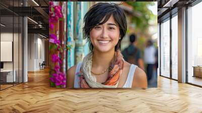 Smiling young woman with short brunette hair sightseeing in a small village street Wall mural