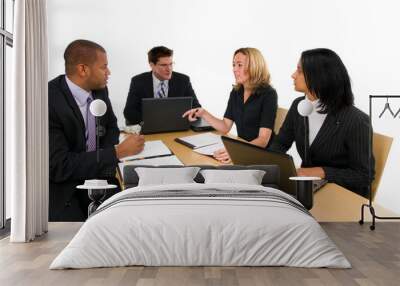 two women and a two men sit at conference table Wall mural