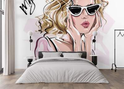 Hand drawn beautiful young woman in sunglasses. Stylish blonde hair girl. Fashion woman look. Sketch. Vector illustration. Wall mural