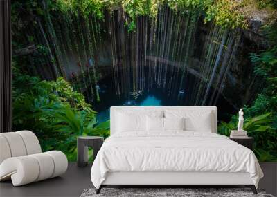 Ik-Kil Cenote, Mexico. Lovely cenote in Yucatan Peninsulla with transparent waters and hanging roots. Chichen Itza, Central America. Wall mural