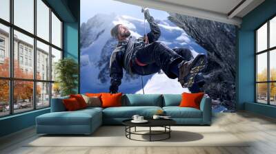 Push yourself to the top. Shot of a mountaineer hanging from a rope on a rockface. Wall mural