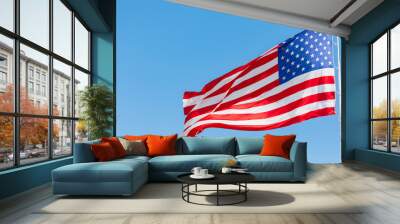 American flag waving in the wind, US flag motion on blue sky, United States of America national flag. USA stars and stripes Wall mural