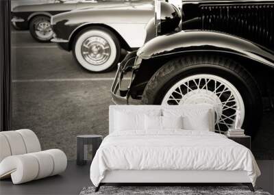 Classic cars parked in a row on the street Wall mural