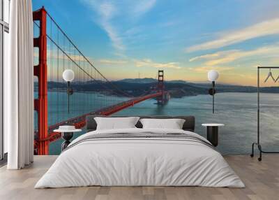 Golden Gate Bridge panorama, San Francisco California, sunset light on cloudy sky  Wall mural