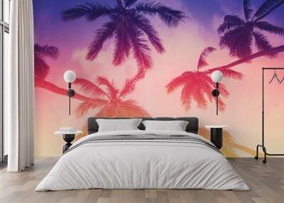 Tropical island sunset with silhouette of palm trees, hot summer day vacation background Wall mural