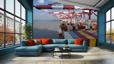 Gantry cranes during cargo operations, loading and unloading containers. on the cargo ships. Wall mural