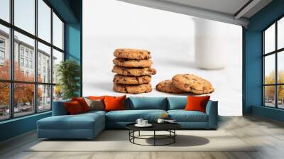 stacked chocolate chip cookies on white background Wall mural