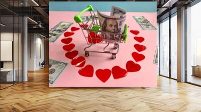 money,banknotes one hundred dollars and small red hearts ,heart -shaped on pink background Wall mural