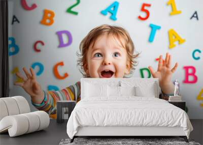 1 2 year old happy child on the background of letters and numbers, the concept of early education for preschool children Wall mural