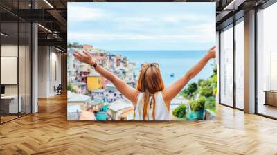 Young woman traveling through Europe, Cinque Terre, Italy Wall mural