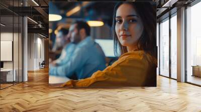 A plus-size woman working on a new project in the office of a startup company. She is working in a co-working space. Wall mural