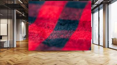 Red and black plaid blanket close up with selective focus Wall mural