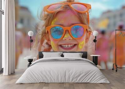 During Holi paint party, a portrait of the girl in sunglasses laughs Wall mural