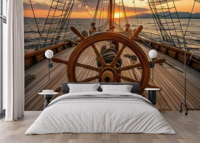 A wooden ship's wheel on the deck of an old sailboat, with waves crashing in the background and the setting sun creating long shadows. Historic ships concept. Wall mural