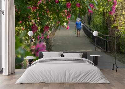 lone mature woman on river walk, downtown durango colorado Wall mural