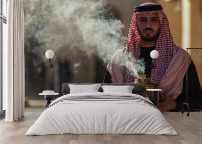 A Man in Traditional Arab Clothing Holding an Incense Burner Wall mural