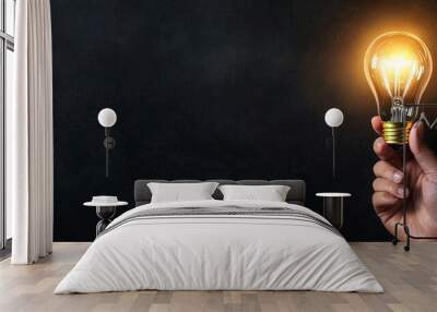 Presented as an abstract hand holding a creative light bulb on an isolated black background, presenting a futuristic concept of transformation innovation invention discovery in the field of Wall mural