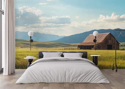 rustic wooden barn in green field with mountain background -  summer landscape scene Wall mural